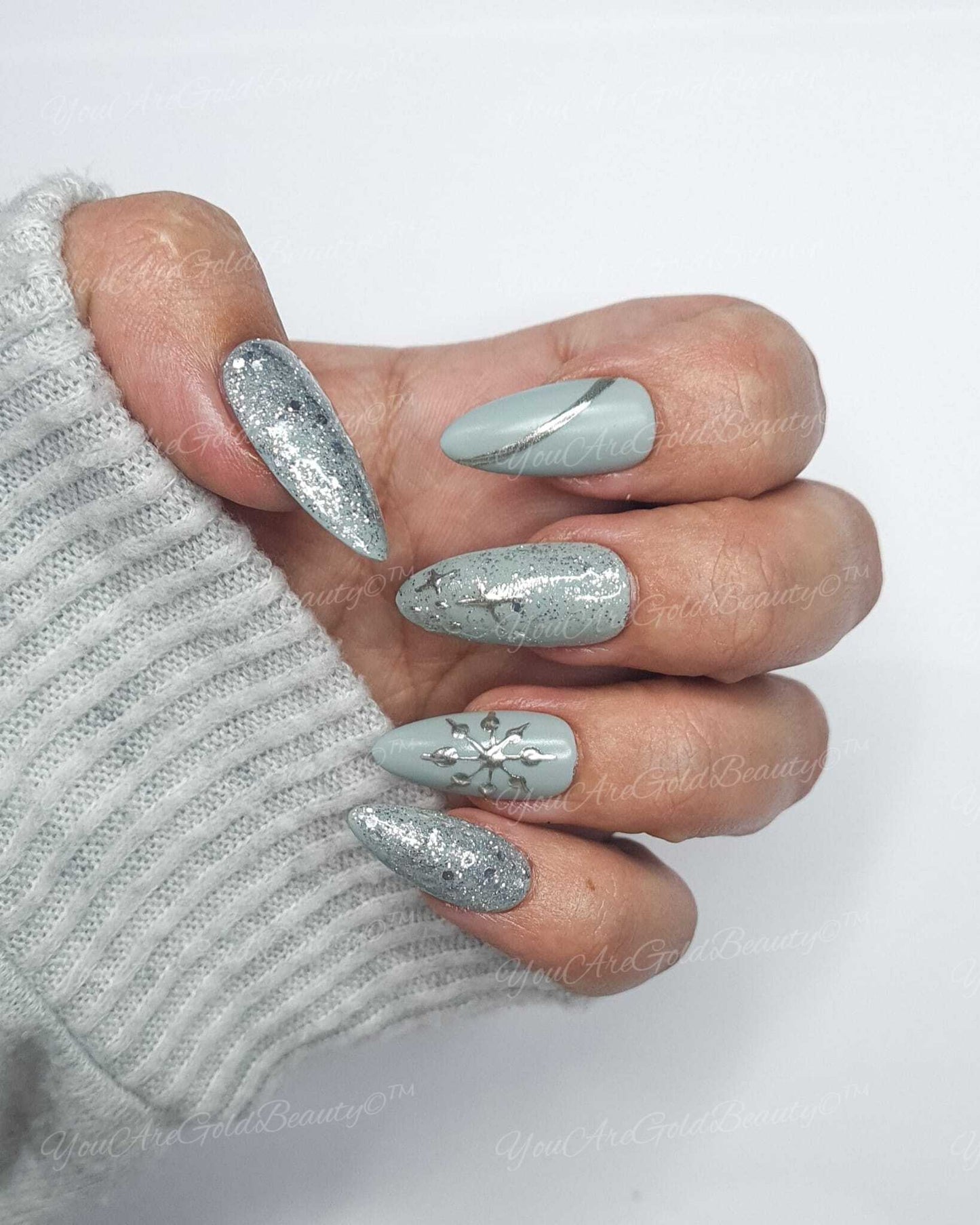 Grey Winter Almond Shape Nails with Silver Chrome Snowflake and Silver Glitter accent nails.