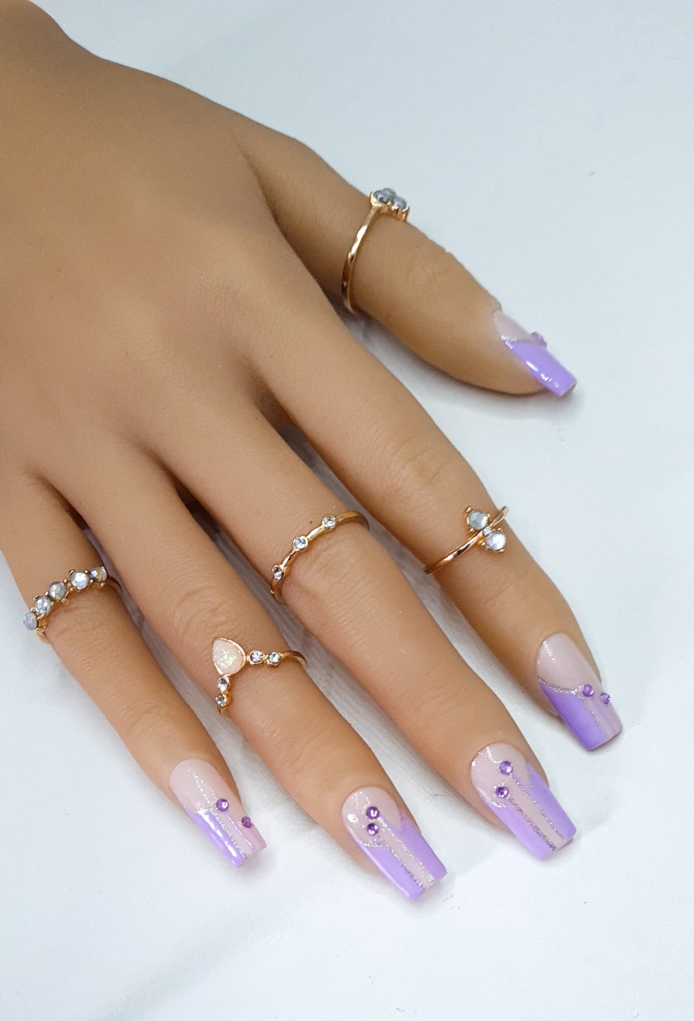 false nails Medium square nails shape in a purple colour with rhinestones bling