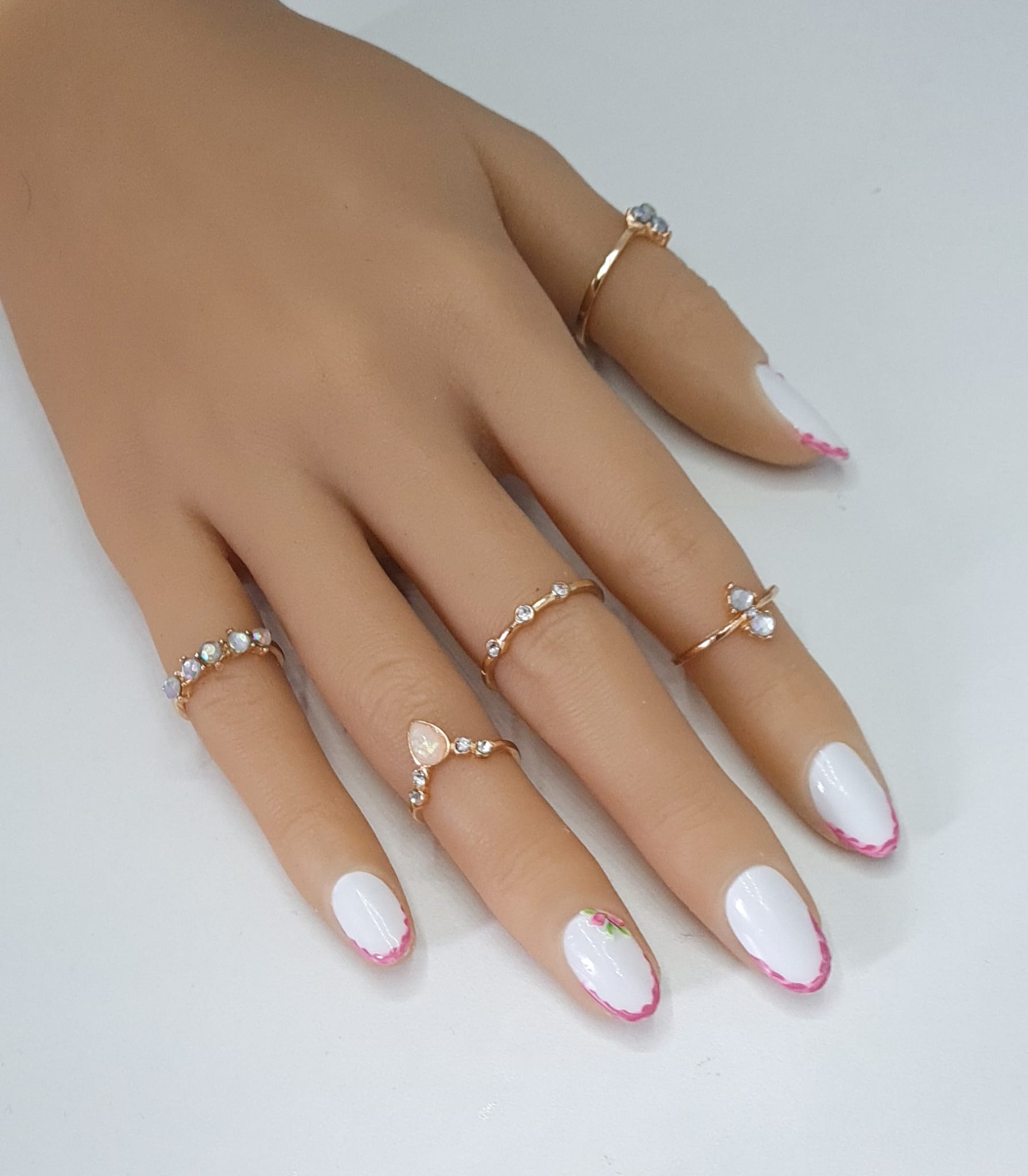 false nails extra short almond nails in a white base colour with pink flower design