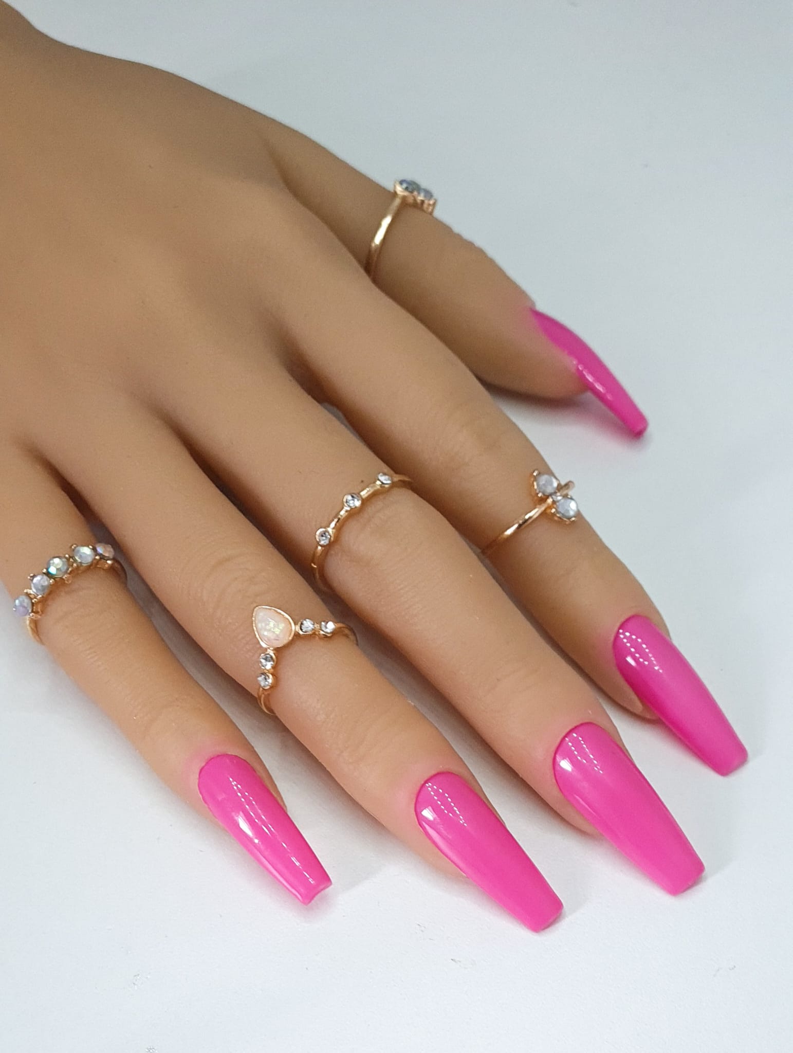 False Nails in coffin nails shape in a rose hot pink base colour